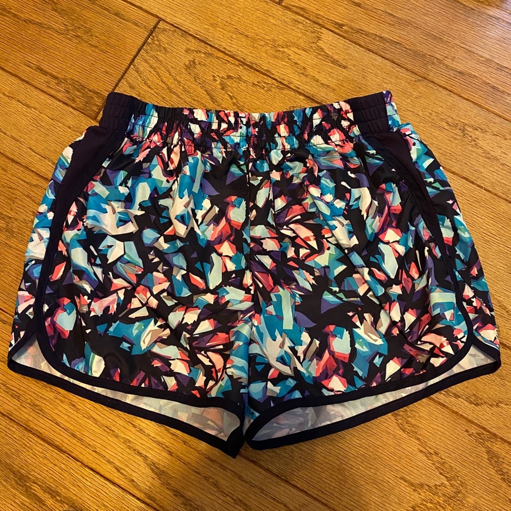 Dark multi-colored athletic shorts.